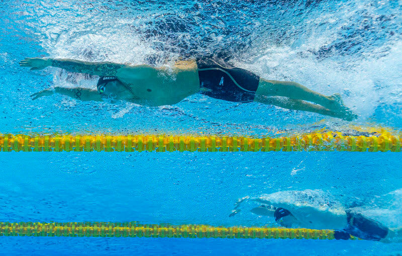 Caeleb Dressel (top) of the United States of America (USA) on his way to a New World Record in the men's 100m Butterfly Semifinal during the Swimming events at the Gwangju 2019 FINA World Championships, Gwangju, South Korea, 26 July 2019.