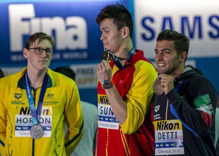(L-R) Second placed Mack Horton of Australia keeps his distance to winner Yang Sun of China while they pose with their medals for photographers after competing in the men's 400m Freestyle Final during the Swimming events at the Gwangju 2019 FINA World Championships, Gwangju, South Korea, 21 July 2019. Gabriele Detti of Italy finishes third.