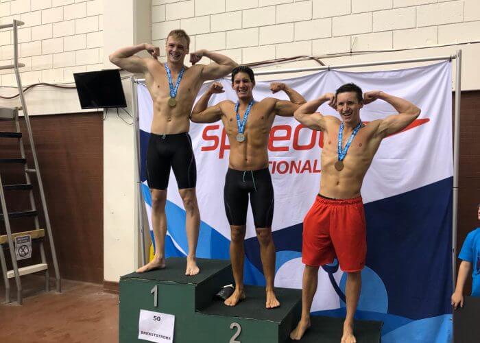 swimmers-flex-on-podium