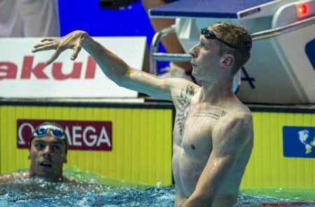 Florian Wellbrock (R) of Germany celebrates after winning in the men's 1500m Freestyle Final while third placed Gregorio Paltrinieri of Italy looks on during the Swimming events at the Gwangju 2019 FINA World Championships, Gwangju, South Korea, 28 July 2019.
