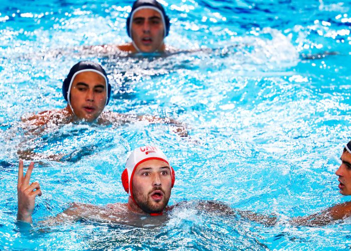 Lima, Monday, August 5, 2019 - Nicolas Constantin-Bicari, left, from Canada reacts to the referee’s call during their Men’s Water Polo Group Phase match against the USA at the Polideportivo Villa Maria del Triunfo at the Pan American Games Lima 2019. Copyright Marcos Brindicci / Lima 2019 Mandatory credits: Lima 2019 ** NO SALES ** NO ARCHIVES **