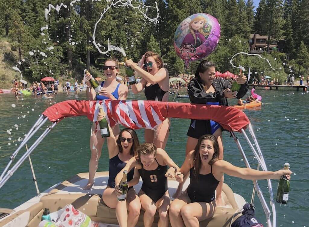 trans-tahoe-relay-open-water-boat-girls-sun