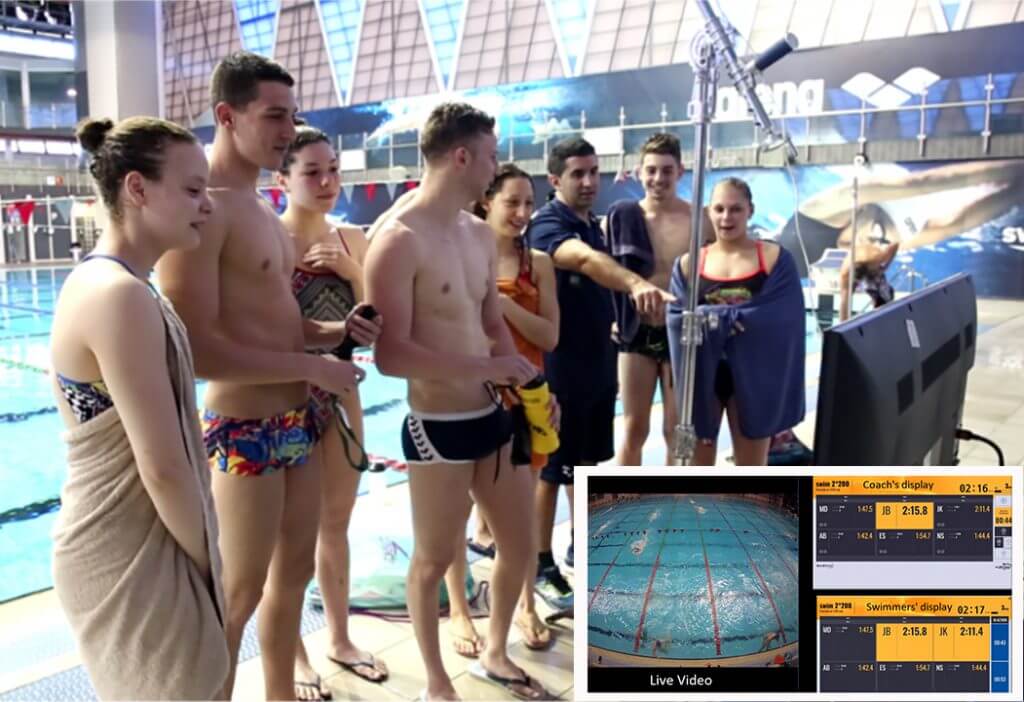 senswim-swimmers-looking-at-data-analytics-screens