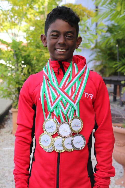 Giovanni with medals he has won