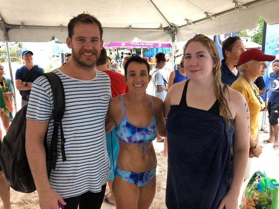 Cameron Bellamy and Jaimie Monahan with a fan at the 2019 Barbados Open Water Festival