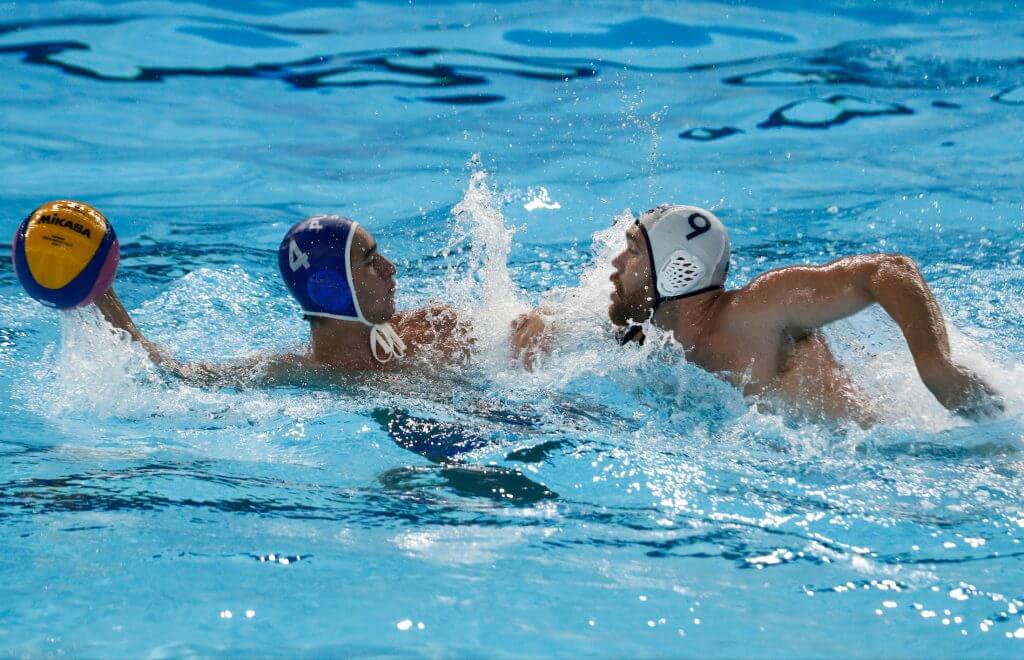 Lima, Tuesday, August 6, 2019 - Jose Loubier from Puerto Rico struggles for the ball with Alexander Bowen from USA during the Men's Group A Preliminary Waterpolo match at Villa María del Triunfo during Pan American Games Lima 2019. Copyright Paul Vallejos / Lima 2019 Mandatory credits: Lima 2019 NO SALES NO ARCHIVES **
