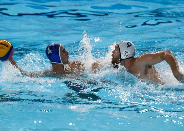 Lima, Tuesday, August 6, 2019 - Jose Loubier from Puerto Rico struggles for the ball with Alexander Bowen from USA during the Men's Group A Preliminary Waterpolo match at Villa María del Triunfo during Pan American Games Lima 2019. Copyright Paul Vallejos / Lima 2019 Mandatory credits: Lima 2019 NO SALES NO ARCHIVES **
