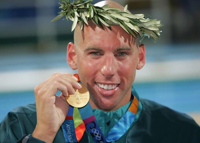 Grant Hackett of Australia shows his gold medal after winning in the men's swimming 1500 metre freestyle final held at the National Aquatics Center at the Athens 2004 Summer Olympic Games in Athens, Greece, Saturday, Aug. 21, 2004. (Photo by Patrick B. Kraemer / MAGICPBK)