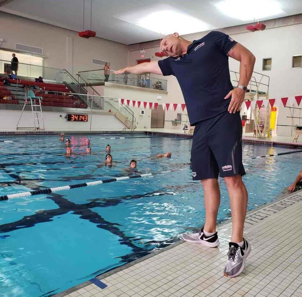 Brett Hawke teaching at a swim camp