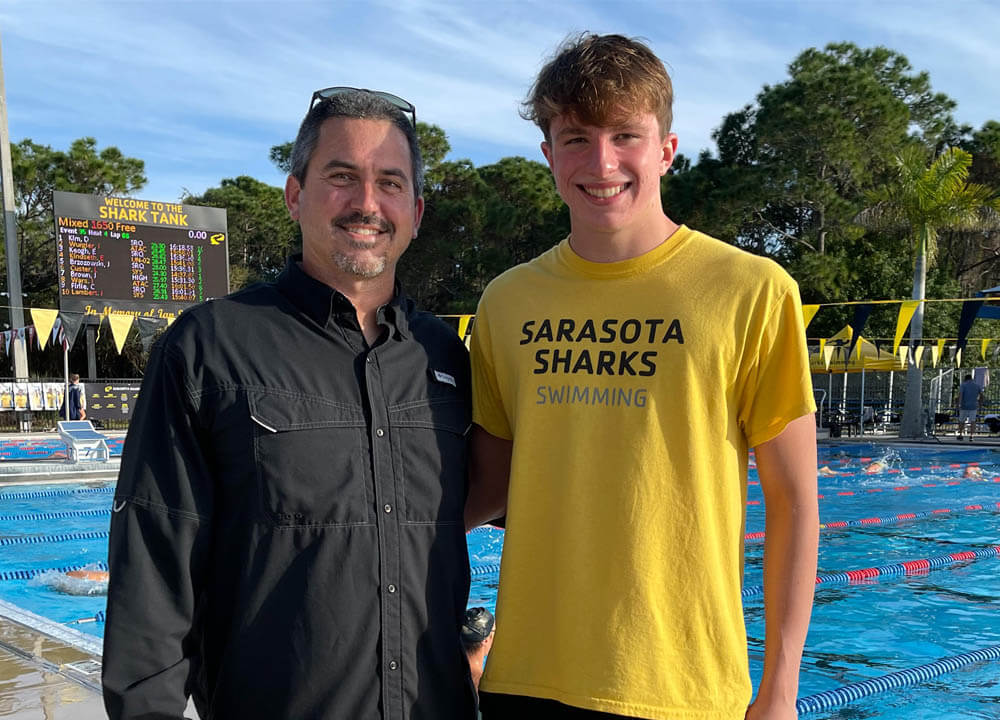 Swimming World March 2021 - Up and Comers - Sarasota YMCA Sharks' Liam Custer - With Coach Brent Arckey