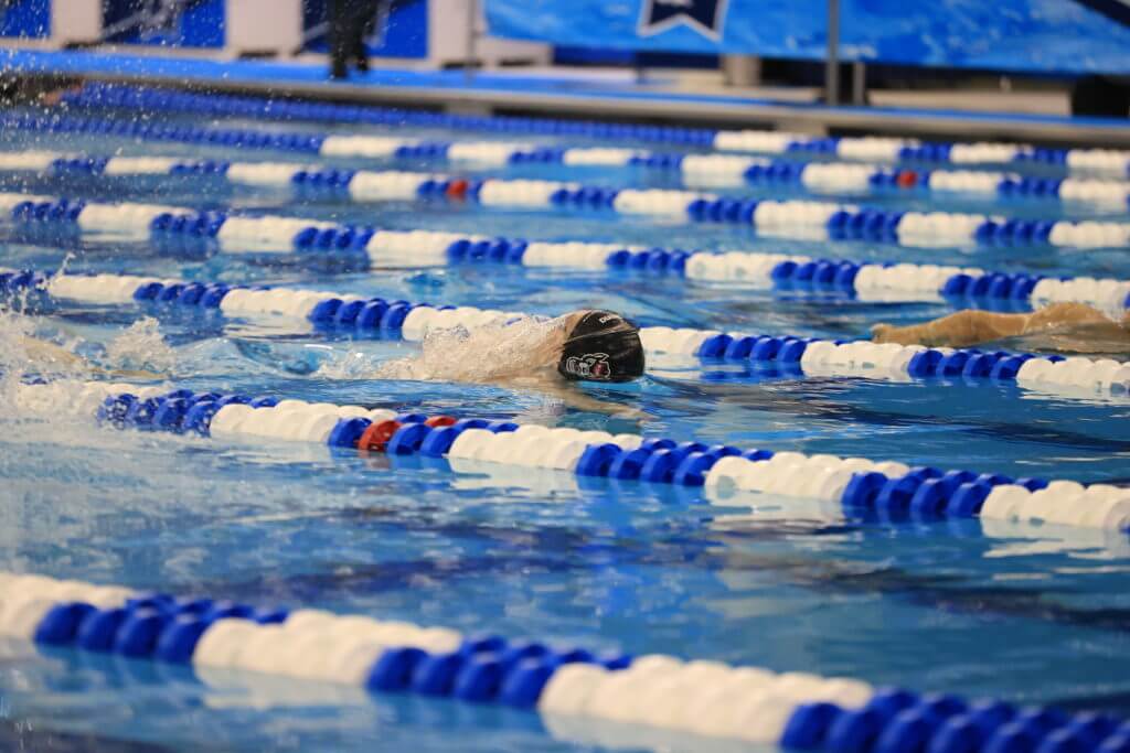 covid-GREENSBORO, NC - MARCH 26: Swimmers compete during the Prelims of the Division I Men’s Swimming & Diving Championships held at the Greensboro Aquatic Center on March 26, 2021 in Greensboro, North Carolina. (Photo by Carlos Morales/NCAA Photos via Getty Images)