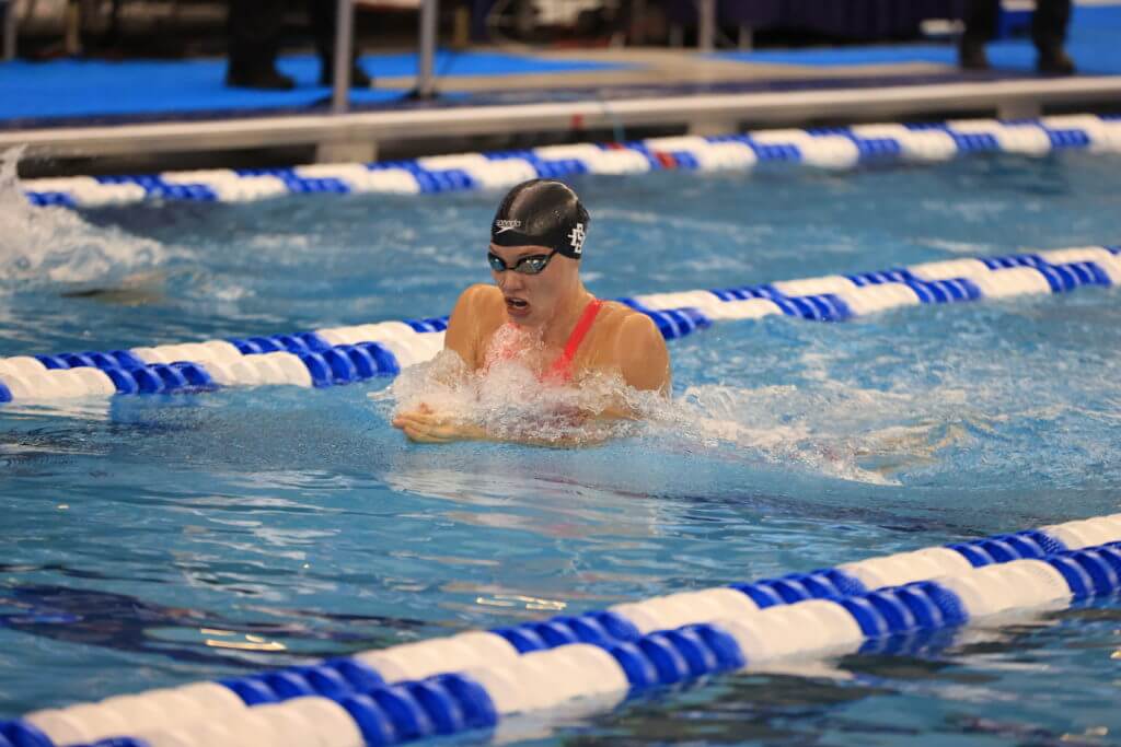 GREENSBORO, NC - MARCH 19: Swimmers compete in the 100 Breastroke Prelims on day three during the Division I Women’s Swimming & Diving Championships held at the Greensboro Aquatic Center on March 19, 2021 in Greensboro, North Carolina. (Photo by Carlos Morales/NCAA Photos via Getty Images)