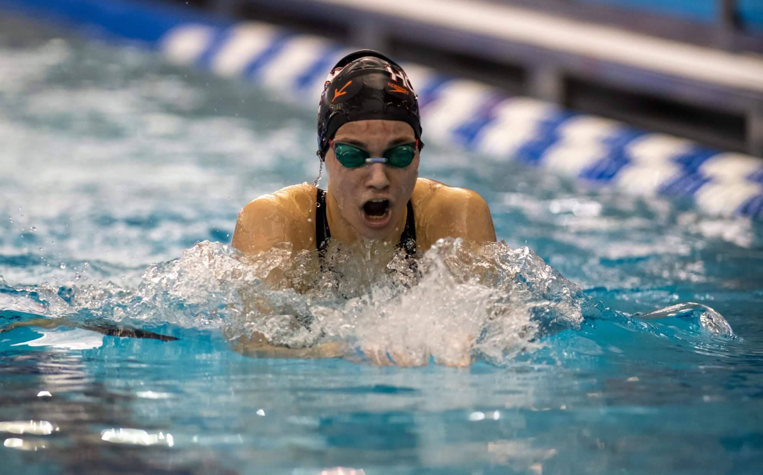 Herbet swims into the record books during freshman year