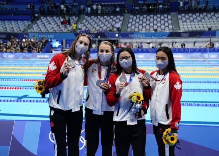 Jul 25, 2021; Tokyo, Japan; Canada team members Kayla Sanchez, Margaret Macneil, Rebecca Smith and Penny Oleksiak with their silver medals during the medals ceremony for the women's 4x100m freestyle relay during the Tokyo 2020 Olympic Summer Games at Tokyo Aquatics Centre. Mandatory Credit: Rob Schumacher-USA TODAY Network