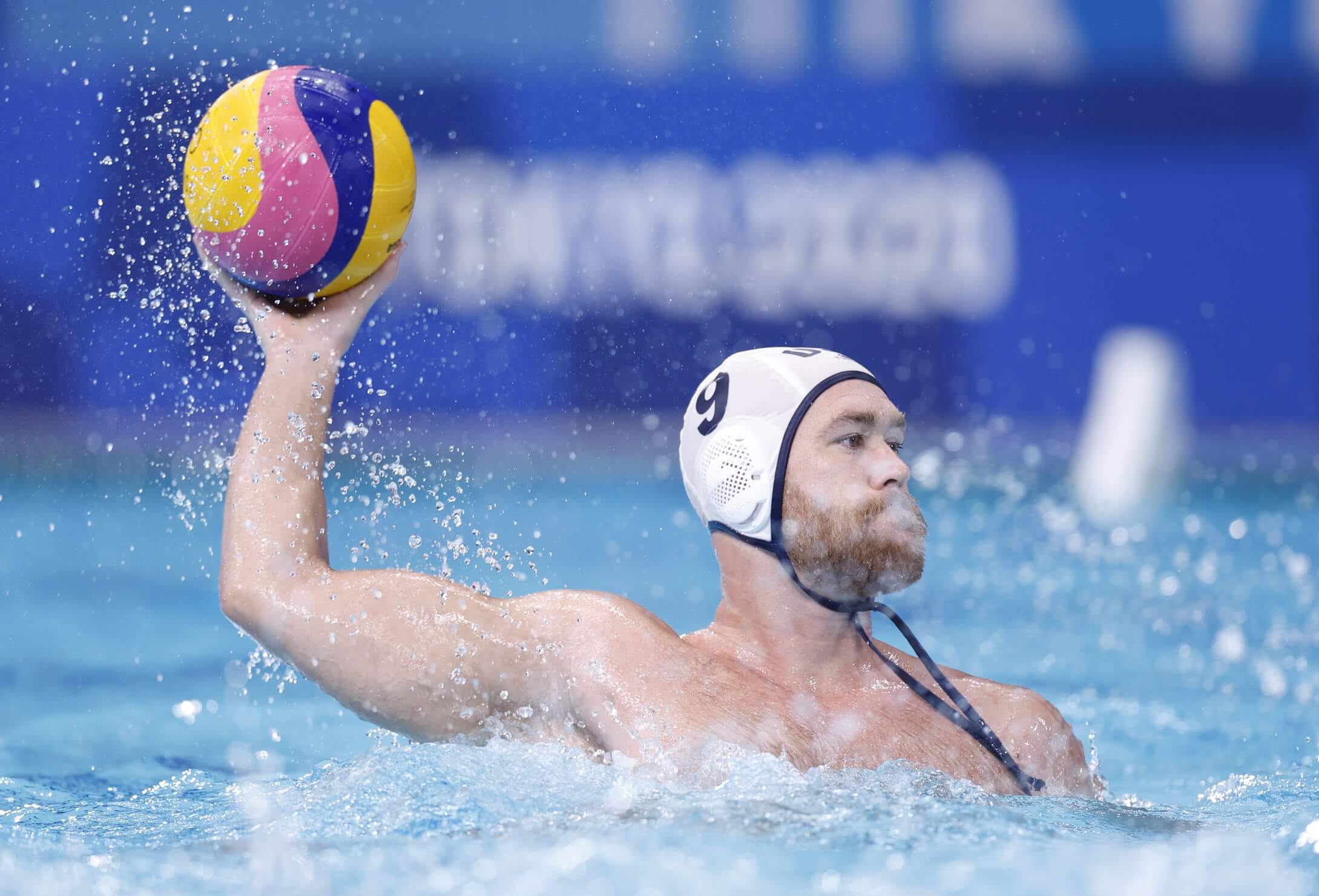 Jul 25, 2021; Tokyo, Japan; United States driver Alex Bowen (9) with the ball against Japan during Group A play during the Tokyo 2020 Olympic Summer Games at Tatsumi Water Polo Centre. Mandatory Credit: Yukihito Taguchi-USA TODAY Sports