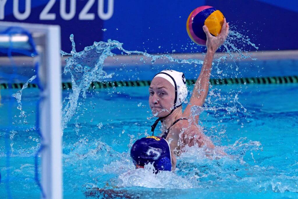 Jul 26, 2021; Tokyo, Japan; United States driver Paige Hauschild (5) shooting the ball against China centre back Xiaohan Mei (3) in womens group B water polo during the Tokyo 2020 Olympic Summer Games at Tatsumi Water Polo Centre. Mandatory Credit: Kirby Lee-USA TODAY Sports