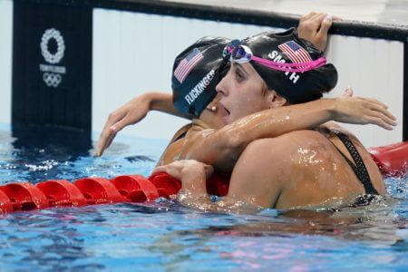 Jul 29, 2021; Tokyo, Japan; Hali Flickinger (USA), left, and Regan Smith (USA) embrace after finishing third and second respectively in the women's 200m butterfly final during the Tokyo 2020 Olympic Summer Games at Tokyo Aquatics Centre. Mandatory Credit: Grace Hollars-USA TODAY Sports