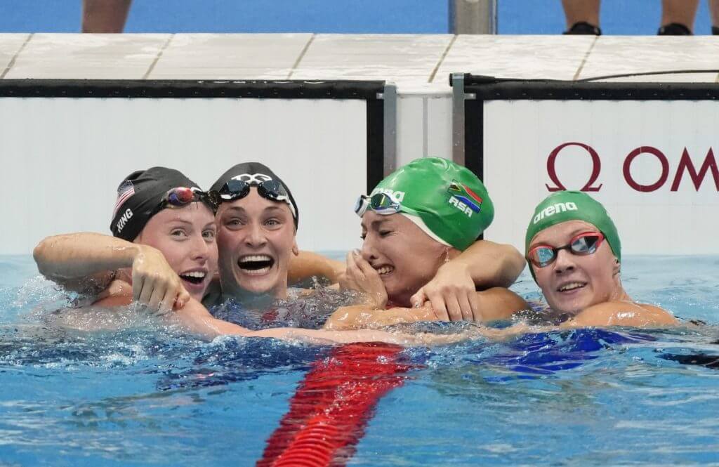 Jul 30, 2021; Tokyo, Japan; Tatjana Schoenmaker (RSA) , Lilly King (USA) and Annie Lazor (USA) are congratulated by Kaylene Corbett (RSA) after the women's 200m breaststroke final during the Tokyo 2020 Olympic Summer Games at Tokyo Aquatics Centre. Mandatory Credit: Rob Schumacher-USA TODAY Sports