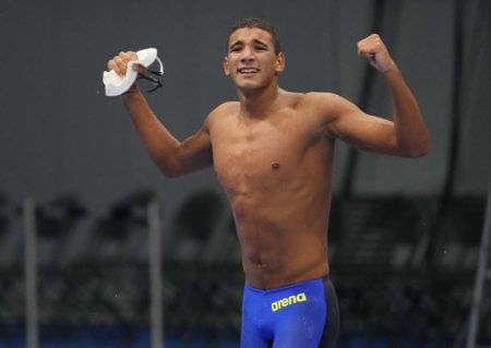 Jul 25, 2021; Tokyo, Japan; Ahmed Hafnaoui (TUN) celebrates after winning the men's 400m freestyle final during the Tokyo 2020 Olympic Summer Games at Tokyo Aquatics Centre. Mandatory Credit: Rob Schumacher-USA TODAY Network