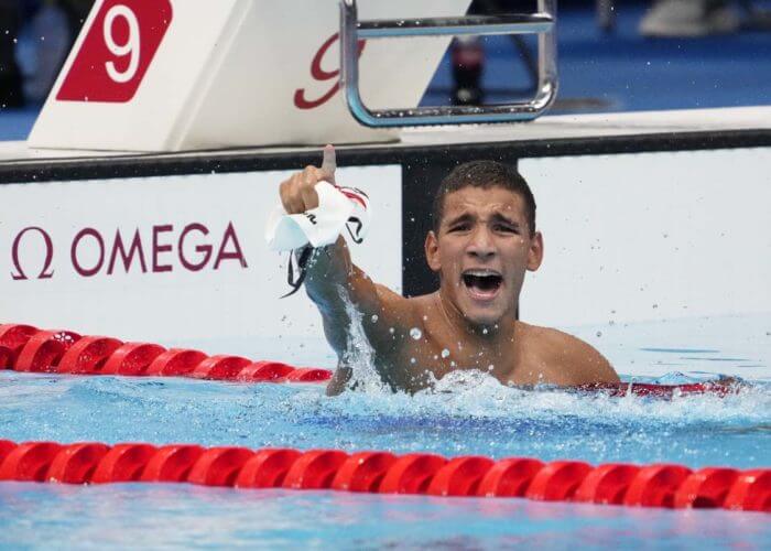 Jul 25, 2021; Tokyo, Japan; Ahmed Hafnaoui (TUN) celebrates after winning the men's 400m freestyle final during the Tokyo 2020 Olympic Summer Games at Tokyo Aquatics Centre. Mandatory Credit: Rob Schumacher-USA TODAY Network
