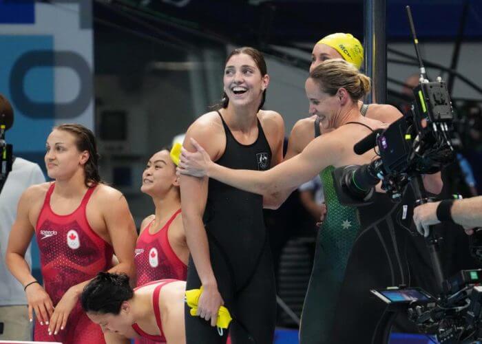 Jul 25, 2021; Tokyo, Japan; Bronte Campbell, Meg Harris and Emma McKeon celebrate their gold medal win during the women's 4x100m freestyle relay final during the Tokyo 2020 Olympic Summer Games at Tokyo Aquatics Centre. Mandatory Credit: Robert Hanashiro-USA TODAY Network