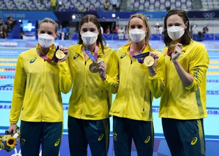 Jul 25, 2021; Tokyo, Japan; Team Australia members Bronte Campbell, Meg Harris, Emma McKeon and Cate Campbell celebrate their gold medal during the medals ceremony for the women's 4x100m freestyle relay during the Tokyo 2020 Olympic Summer Games at Tokyo Aquatics Centre. Mandatory Credit: Rob Schumacher-USA TODAY Network