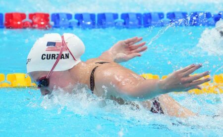 Jul 24, 2021; Tokyo, Japan; Claire Curzan (USA) during the women's 100m butterfly heats during the Tokyo 2020 Olympic Summer Games at Tokyo Aquatics Centre. Mandatory Credit: Rob Schumacher-USA TODAY Network