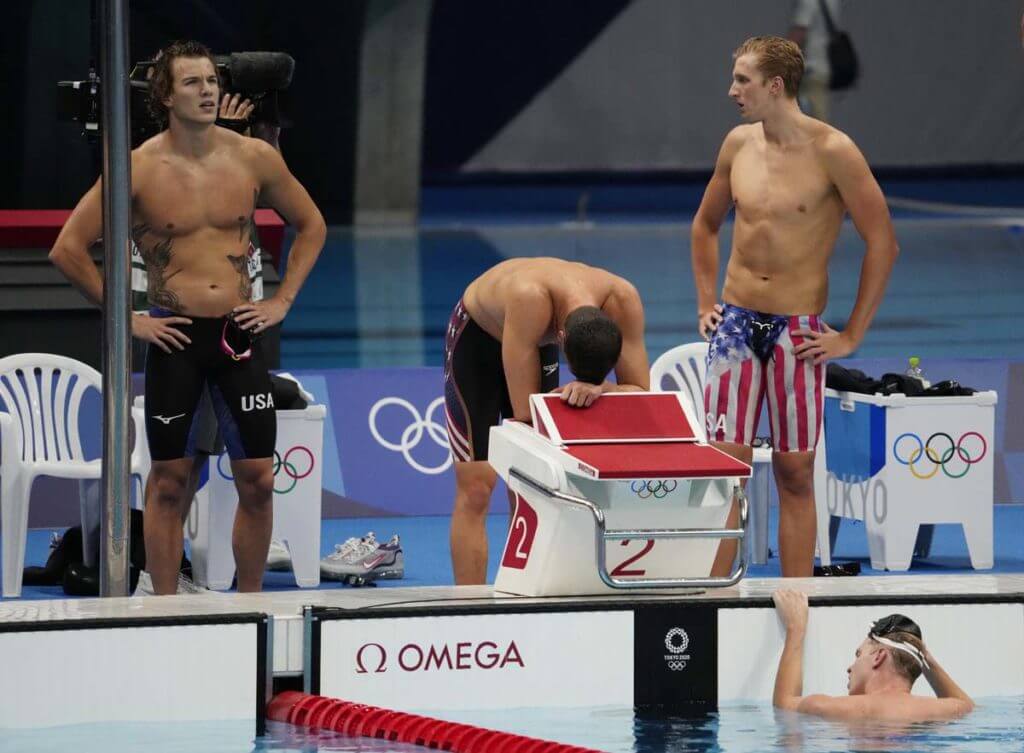 Jul 28, 2021; Tokyo, Japan; United States relay team members react after the men's 4x200m freestyle relay during the Tokyo 2020 Olympic Summer Games at Tokyo Aquatics Centre. Mandatory Credit: Rob Schumacher-USA TODAY Sports