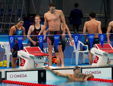 Jul 31, 2021; Tokyo, Japan; USA relay team reacts after the mixed 4x100m medley relay final during the Tokyo 2020 Olympic Summer Games at Tokyo Aquatics Centre. Mandatory Credit: Rob Schumacher-USA TODAY Sports