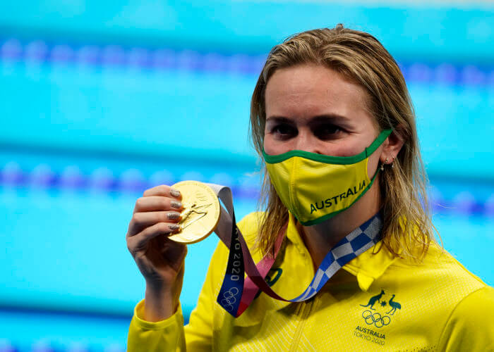 Jul 28, 2021; Tokyo, Japan; Ariarne Titmus (AUS) with her gold medal during the medals ceremony for the women's 200m freestyle during the Tokyo 2020 Olympic Summer Games at Tokyo Aquatics Centre. Mandatory Credit: Rob Schumacher-USA TODAY Sports