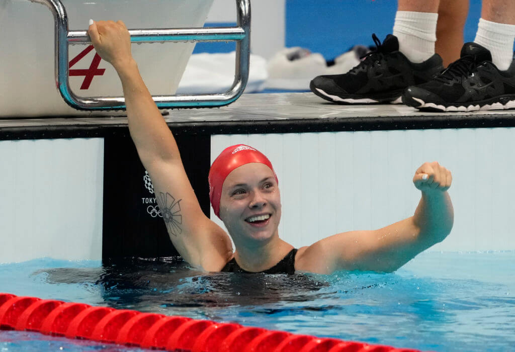 Jul 31, 2021; Tokyo, Japan; Anna Hopkin (GBR) celebrates after anchoring the relay team to victory in the mixed 4x100m medley relay final during the Tokyo 2020 Olympic Summer Games at Tokyo Aquatics Centre. Mandatory Credit: Rob Schumacher-USA TODAY Sports