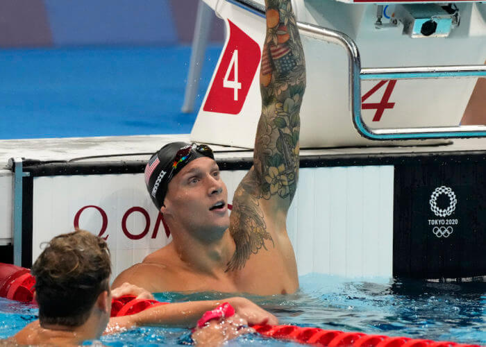 Jul 31, 2021; Tokyo, Japan; Caeleb Dressel (USA) celebrates after winning the men's 100m butterfly final during the Tokyo 2020 Olympic Summer Games at Tokyo Aquatics Centre. Mandatory Credit: Rob Schumacher-USA TODAY Sports