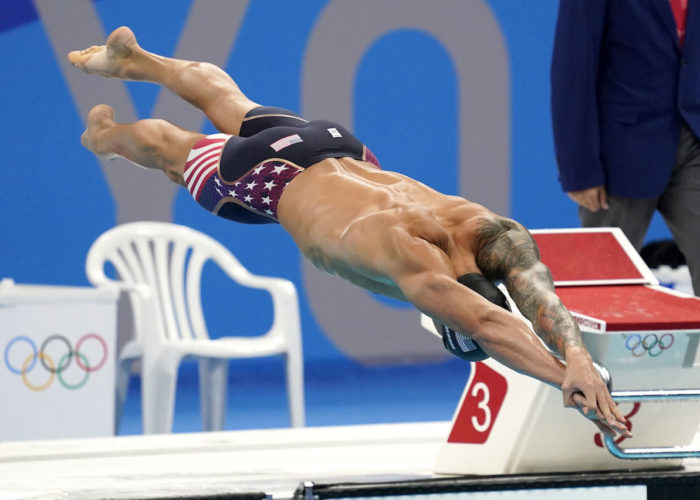 Jul 31, 2021; Tokyo, Japan; Caeleb Dressel (USA) dives into the water at the start of the men's 50 freestyle semifinal during the Tokyo 2020 Olympic Summer Games at Tokyo Aquatics Centre. Mandatory Credit: Grace Hollars-USA TODAY Sports