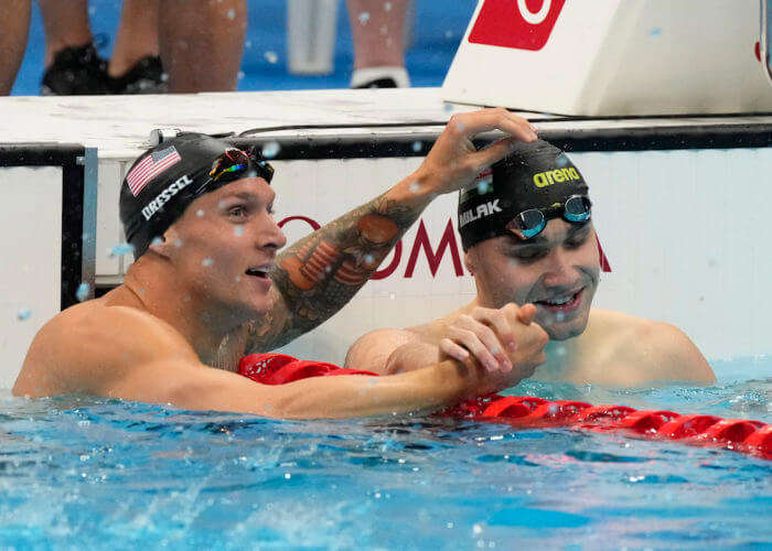 Jul 31, 2021; Tokyo, Japan; Caeleb Dressel (USA) and Kristof Milak (HUN) react after placing first and second in the men's 100m butterfly final during the Tokyo 2020 Olympic Summer Games at Tokyo Aquatics Centre. Mandatory Credit: Rob Schumacher-USA TODAY Sports