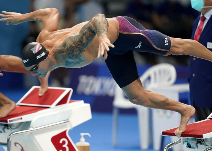 Jul 31, 2021; Tokyo, Japan; Caeleb Dressel (USA) dives into the water at the start of the men's 100m butterfly final during the Tokyo 2020 Olympic Summer Games at Tokyo Aquatics Centre. Mandatory Credit: Grace Hollars-USA TODAY Sports
