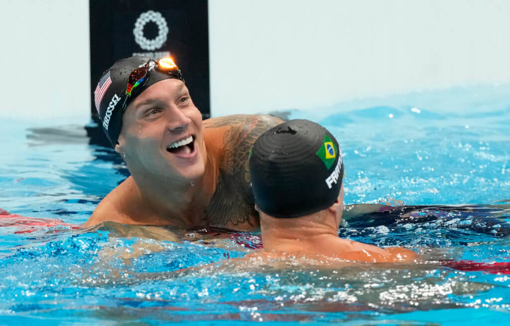 Aug 1, 2021; Tokyo, Japan; Caeleb Dressel (USA) and Bruno Fratus (BRA) react after the men's 50m freestyle final during the Tokyo 2020 Olympic Summer Games at Tokyo Aquatics Centre. Mandatory Credit: Rob Schumacher-USA TODAY Sports