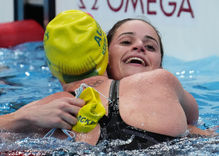 Jul 27, 2021; Tokyo, Japan; Kaylee McKeown (AUS), right, is congratulated by Emily Seebohm (AUS) after winning the women's 100m backstroke final during the Tokyo 2020 Olympic Summer Games at Tokyo Aquatics Centre. Mandatory Credit: Robert Hanashiro-USA TODAY Sports