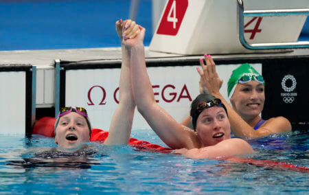 Jul 27, 2021; Tokyo, Japan; Lydia Jacoby (USA), Tatjana Schoenmaker (RSA) and Lilly King (USA) react after finishing first, second and third in the women's 100m breaststroke final during the Tokyo 2020 Olympic Summer Games at Tokyo Aquatics Centre. Mandatory Credit: Rob Schumacher-USA TODAY Sports