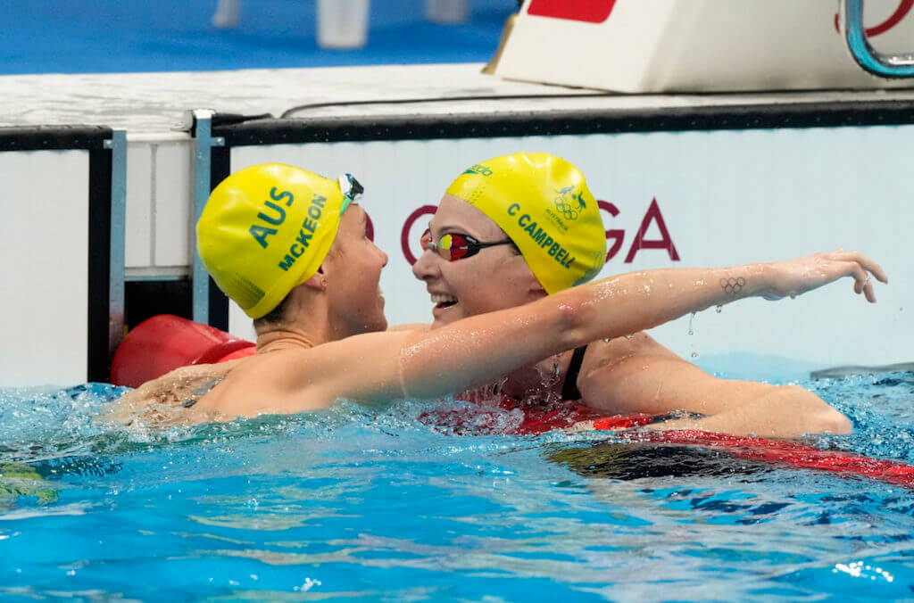 Aug 1, 2021; Tokyo, Japan; Emma McKeon (AUS) celebrates with Cate Campbell (AUS) after winning the women's 50m freestyle final during the Tokyo 2020 Olympic Summer Games at Tokyo Aquatics Centre. Mandatory Credit: Rob Schumacher-USA TODAY Sports