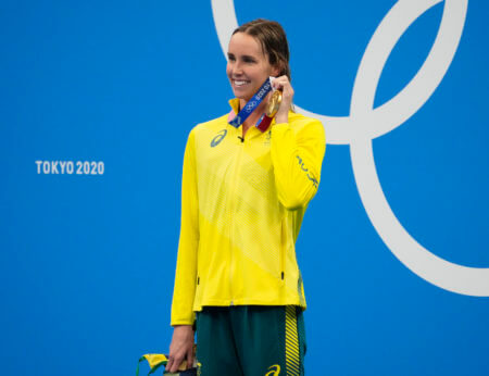 Aug 1, 2021; Tokyo, Japan; Emma McKeon (AUS) with her gold medal during the medals ceremony for the women's 50m freestyle during the Tokyo 2020 Olympic Summer Games at Tokyo Aquatics Centre. Swimming Mandatory Credit: Robert Hanashiro-USA TODAY Sports