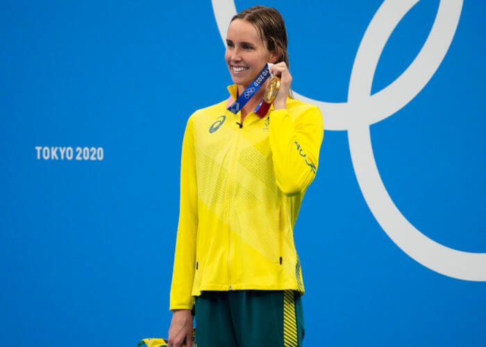 Aug 1, 2021; Tokyo, Japan; Emma McKeon (AUS) with her gold medal during the medals ceremony for the women's 50m freestyle during the Tokyo 2020 Olympic Summer Games at Tokyo Aquatics Centre. Mandatory Credit: Robert Hanashiro-USA TODAY Sports