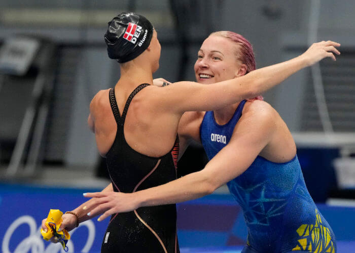 Aug 1, 2021; Tokyo, Japan; Pernille Blume (DEN) and Sarah Sjoestroem (SWE) celebrate their second and third place finish in the women's 50m freestyle final during the Tokyo 2020 Olympic Summer Games at Tokyo Aquatics Centre. Mandatory Credit: Rob Schumacher-USA TODAY Sports