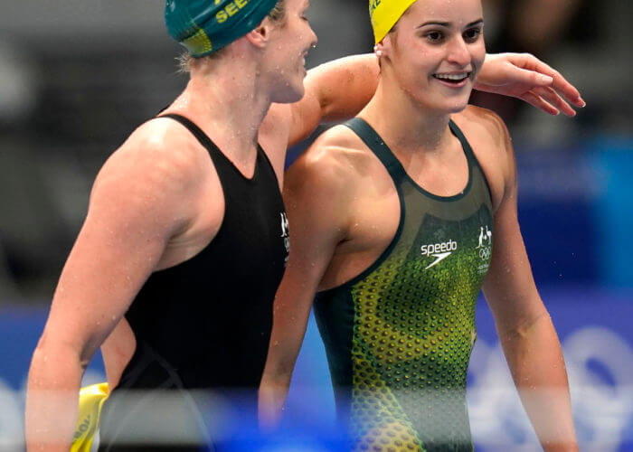 Jul 31, 2021; Tokyo, Japan; Emily Seebohm (AUS), left, puts an arm around Kaylee McKeown (AUS) after the pair finished third and first respectively in the women's 200m backstroke final during the Tokyo 2020 Olympic Summer Games at Tokyo Aquatics Centre. Mandatory Credit: Grace Hollars-USA TODAY Sports