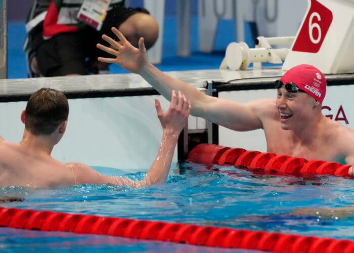 Jul 27, 2021; Tokyo, Japan; Tom Dean (GBR) celebrates with Duncan Scott (GBR) after placing first and second in the men's 200m freestyle final during the Tokyo 2020 Olympic Summer Games at Tokyo Aquatics Centre. Mandatory Credit: Rob Schumacher-USA TODAY Sports