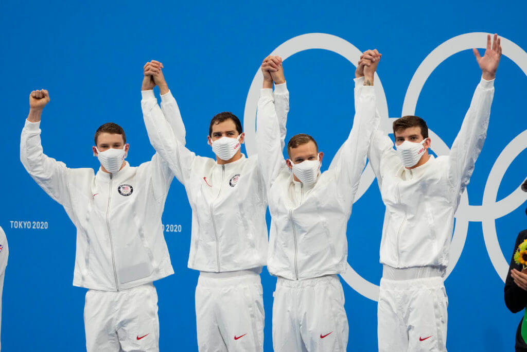 Aug 1, 2021; Tokyo, Japan; Ryan Murphy (USA) , Michael Andrew (USA) , Caeleb Dressel (USA) and Zach Apple (USA) celebrate during the medals ceremony for the men's 4x100m medley relay during the Tokyo 2020 Olympic Summer Games at Tokyo Aquatics Centre. Mandatory Credit: Rob Schumacher-USA TODAY Sports