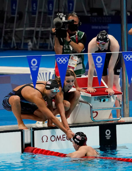 Aug 1, 2021; Tokyo, Japan; Torri Huske (USA), Regan Smith (USA) , Lydia Jacoby (USA) and Abbey Weitzeil (USA) react after their second place finish in the women's 4x100m medley final during the Tokyo 2020 Olympic Summer Games at Tokyo Aquatics Centre. Mandatory Credit: Rob Schumacher-USA TODAY Sports