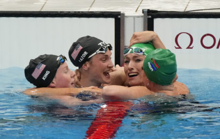 Jul 30, 2021; Tokyo, Japan; Tatjana Schoenmaker (RSA) , Lilly King (USA) and Annie Lazor (USA) are congratulated by Kaylene Corbett (RSA) after the women's 200m breaststroke final during the Tokyo 2020 Olympic Summer Games at Tokyo Aquatics Centre. Mandatory Credit: Rob Schumacher-USA TODAY Sports