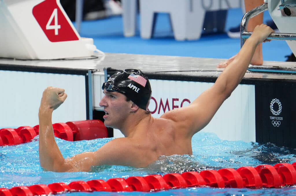 Jul 26, 2021; Tokyo, Japan; Zach Apple (USA) celebrates after anchoring the team to a gold medal in the men's 4x100m freestyle relay final during the Tokyo 2020 Olympic Summer Games at Tokyo Aquatics Centre. Mandatory Credit: Robert Hanashiro-USA TODAY Sports