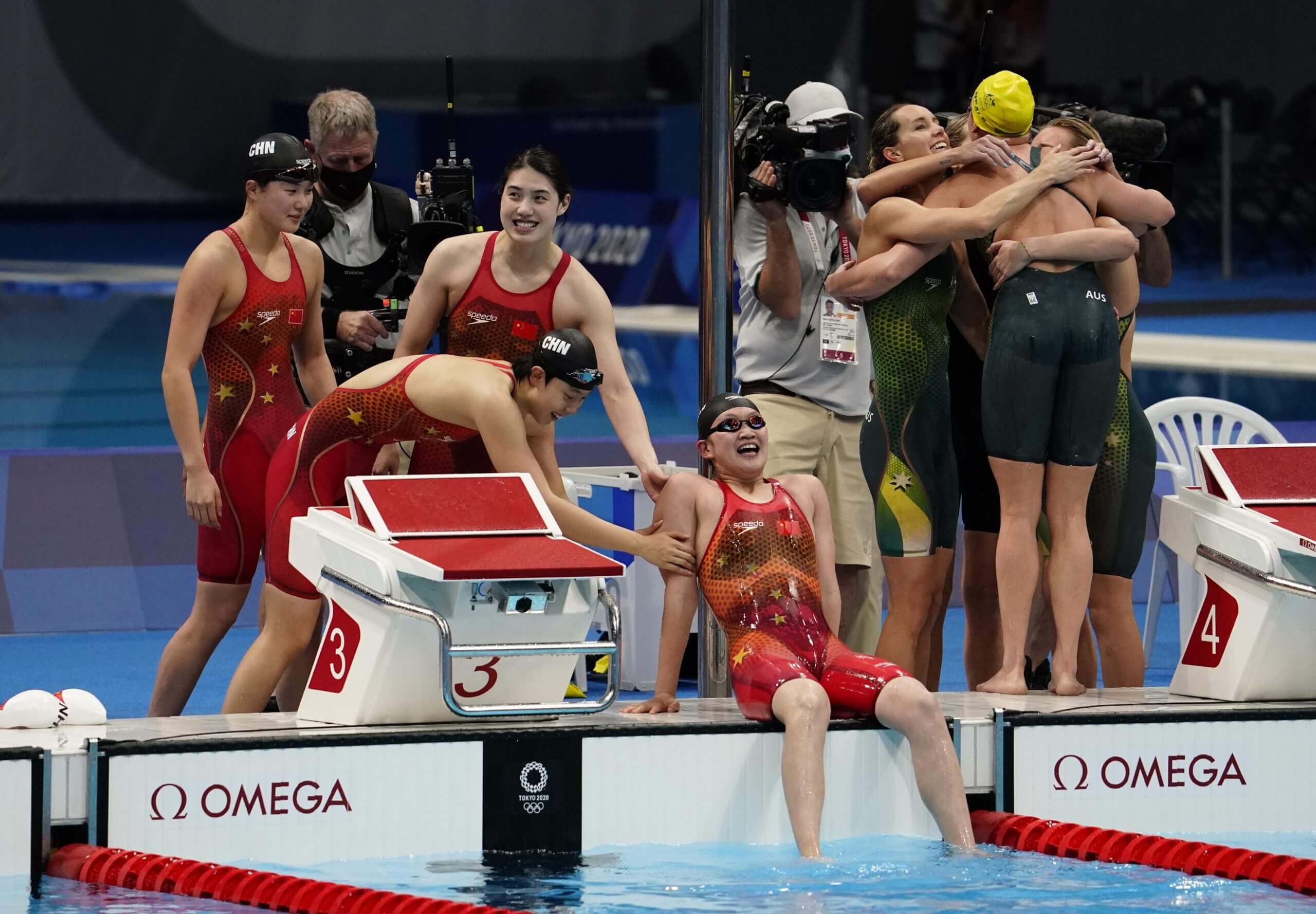 Jul 29, 2021; Tokyo, Japan; China relay team celebrates their victory in the women's 4x200m freestyle relay final during the Tokyo 2020 Olympic Summer Games at Tokyo Aquatics Centre. Mandatory Credit: Rob Schumacher-USA TODAY Sports