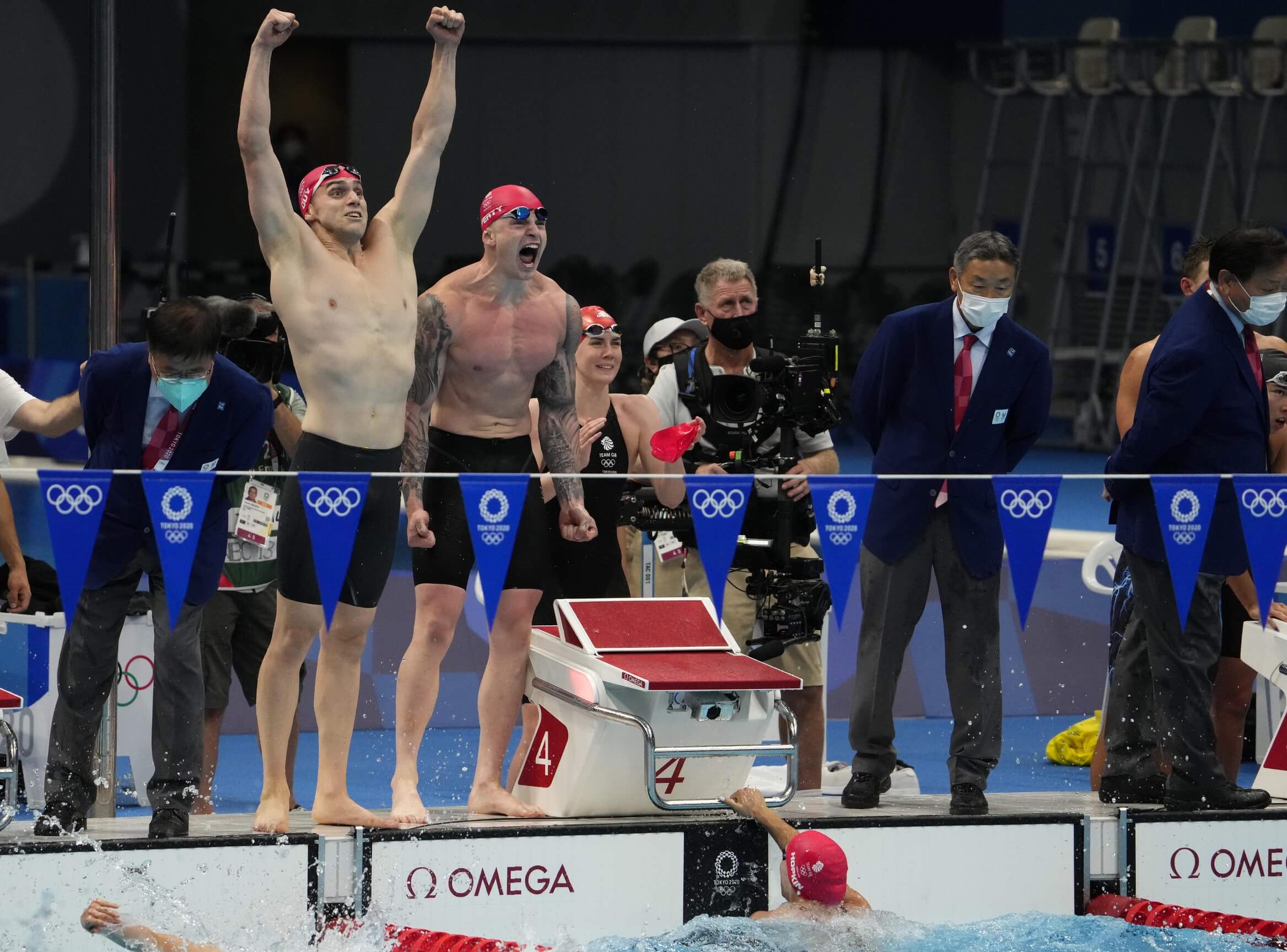 Jul 31, 2021; Tokyo, Japan; James Guy (GBR) and Adam Peaty (GBR) celebrate victory in the mixed 4x100m medley relay final during the Tokyo 2020 Olympic Summer Games at Tokyo Aquatics Centre. Mandatory Credit: Rob Schumacher-USA TODAY Sports